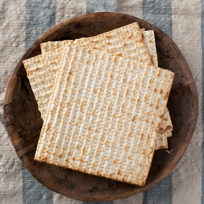 Photo of matzah on a wooden tray